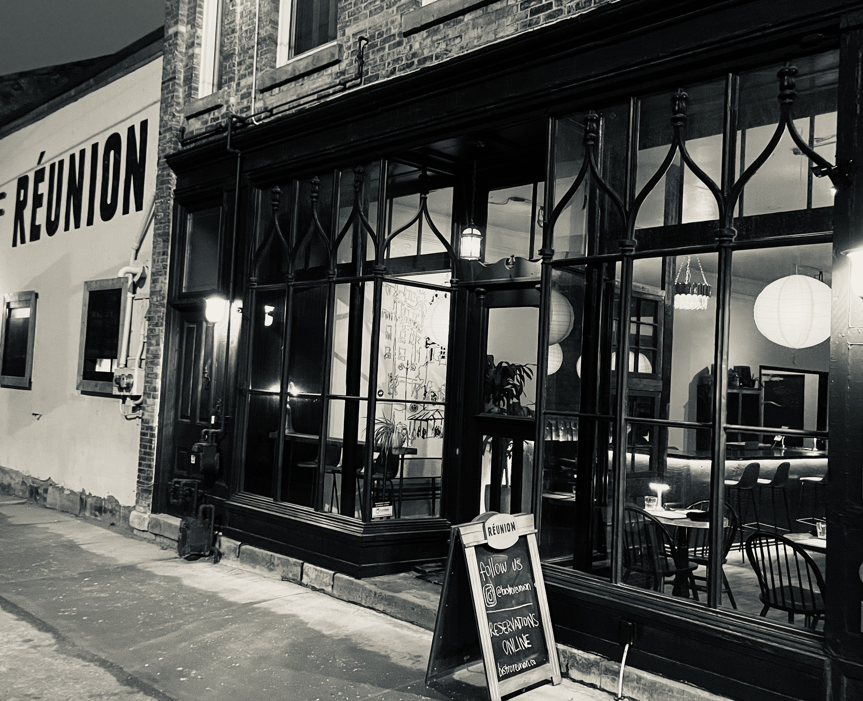 A photo of the frontage of Bistro Reunion in Black and White.