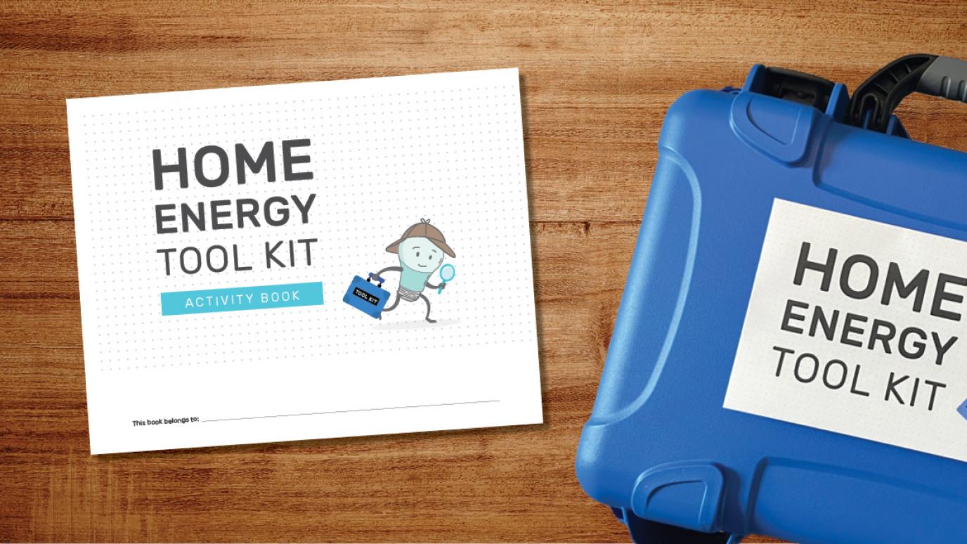 The Home Energy Tool Kit sitting on a table top next to the activity book