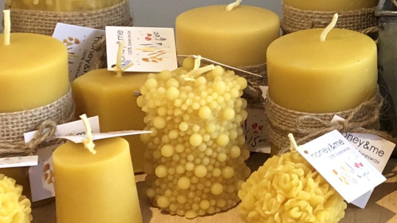 various beeswax candles on a wooden board