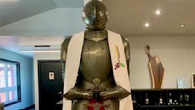 Silver knights gear statue with red and white sash and garments located at Cox Creek Cellars brewery