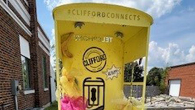 Painted and decorated phone booth located downtown Clifford