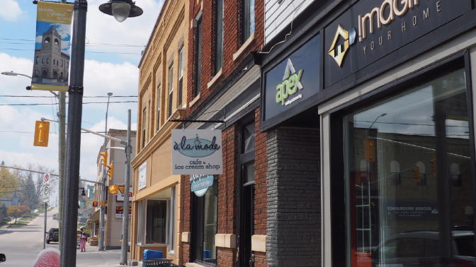 Street view of downtown Drayton showing local businesses store fronts.