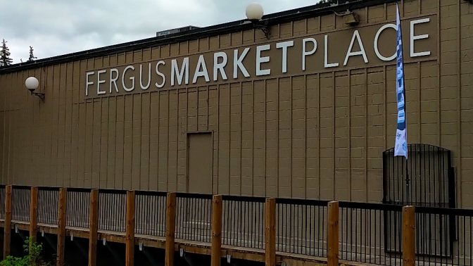 A photo of the Fergus Market Place on the River signage.