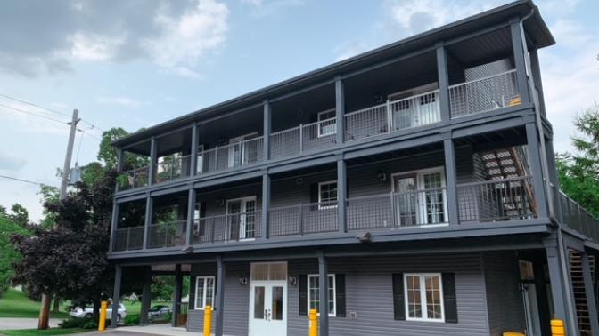 Photo of the Greystone Housing building from the parking lot.