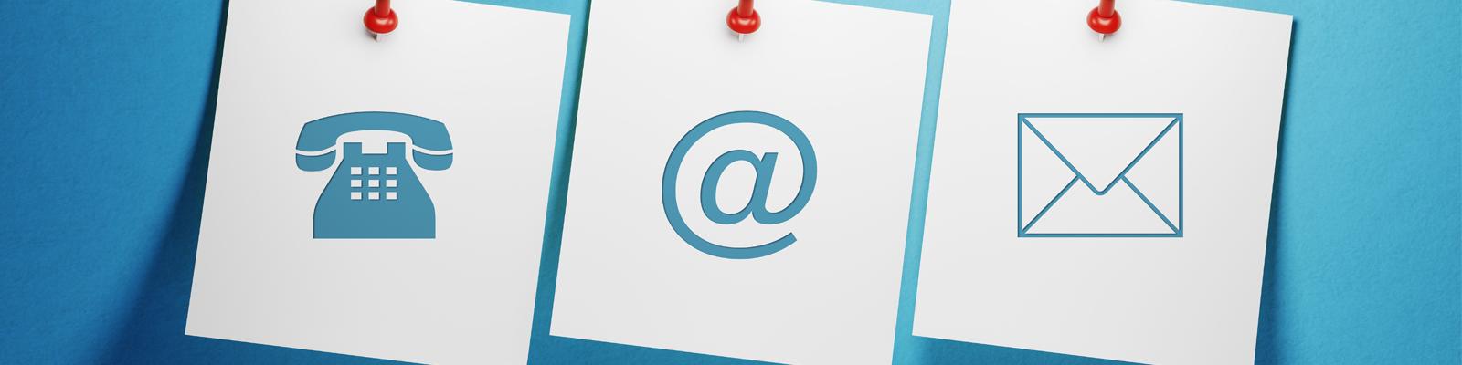 3 notes pinned to a blue wall. The notes have a symbol of a phone, an 'at' symbol, and an envelope.