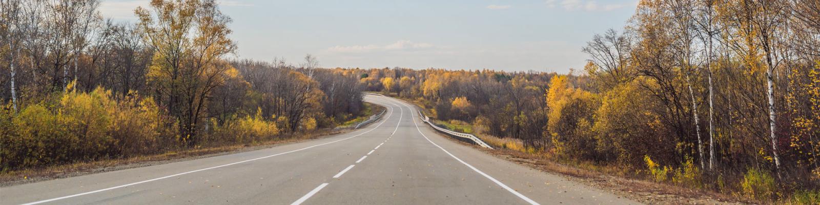 Wide open country road in autumn
