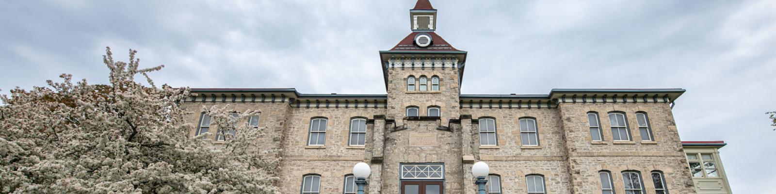 Front of the historic Wellington County Museum and Archives limestone building