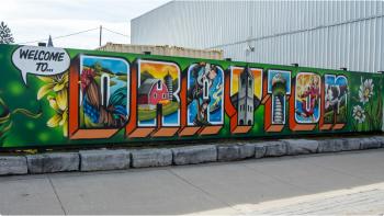 A mural that spells out "Drayton" in very colourful graffiti depicting lots of community favourites. 