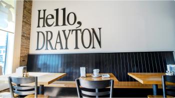A mural that spells out "Drayton" in very colourful graffiti depicting lots of community favourites. 