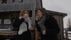two individuals eating and drinking cafe and bakery goods