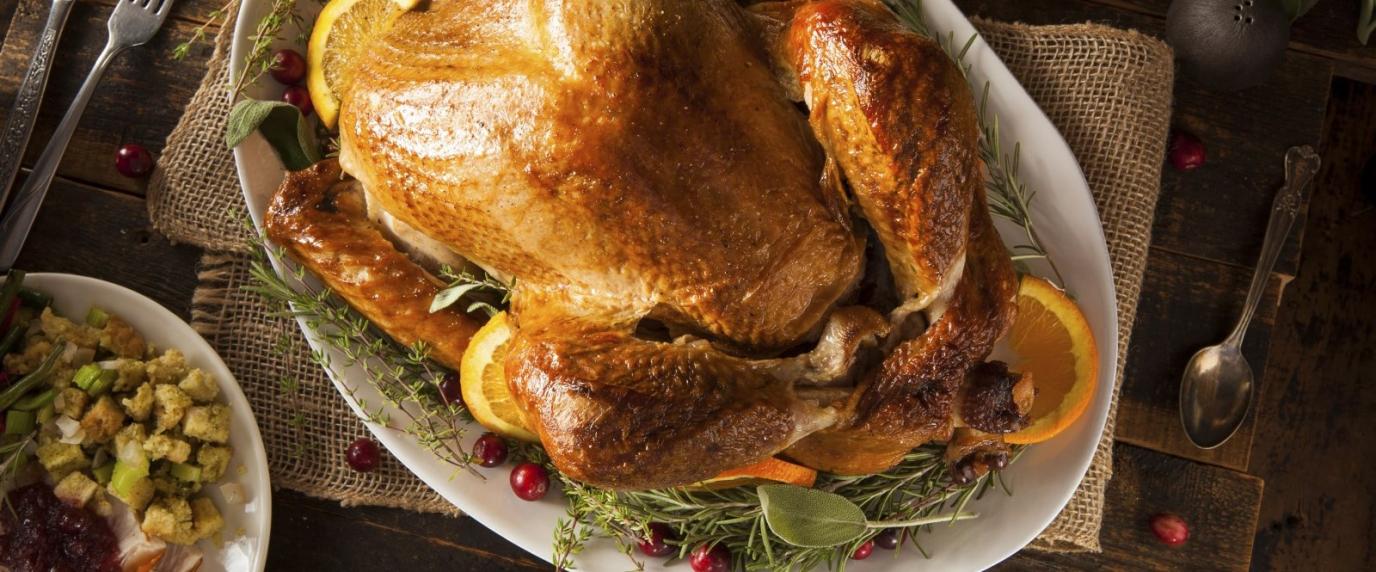 cooked turkey on a plate with all the fixin's