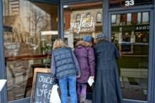 Women standing outside a store